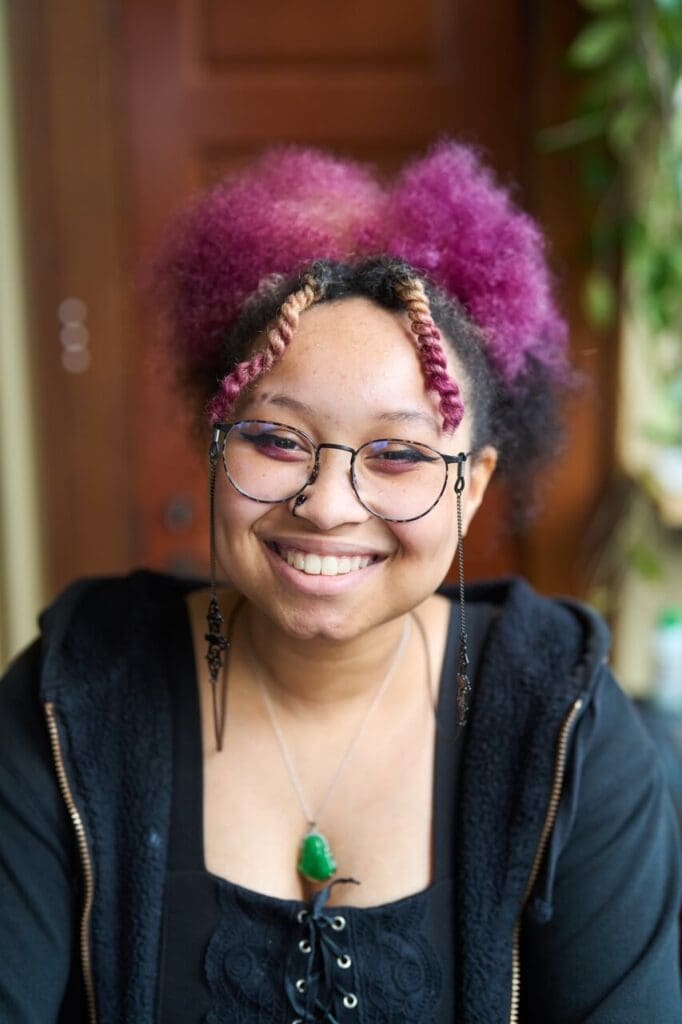 A high school girl smiles for a portrait.