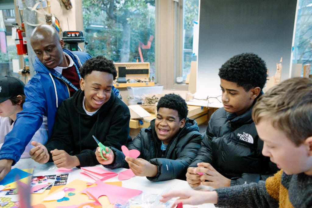 A group of students work on an art project together.