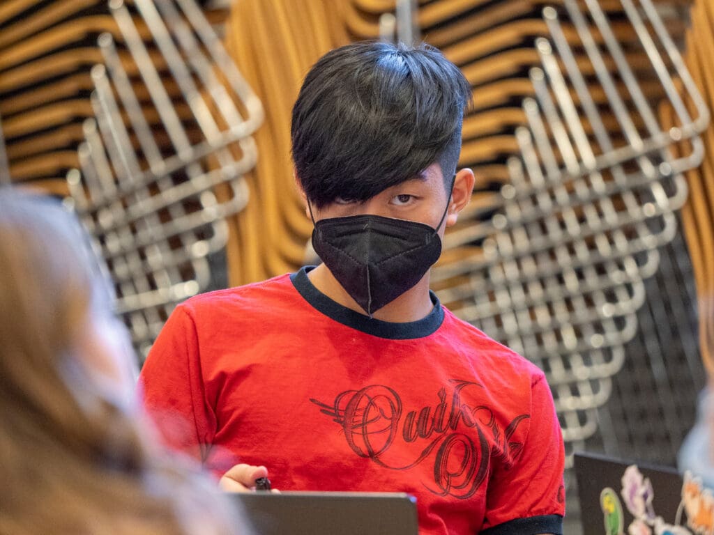 High school student from the Downtown School working on a laptop.